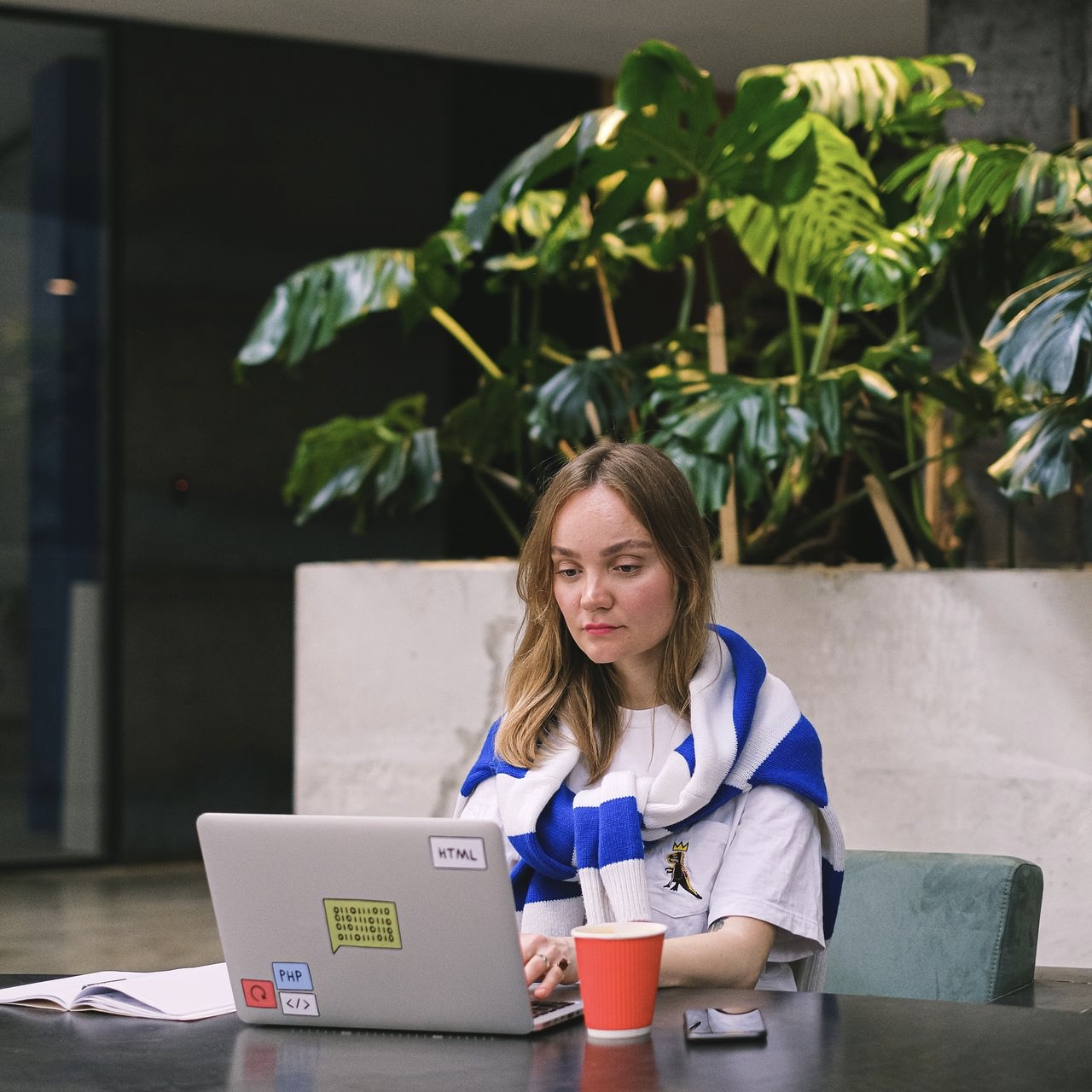 Independent freelancer building a website on a laptop